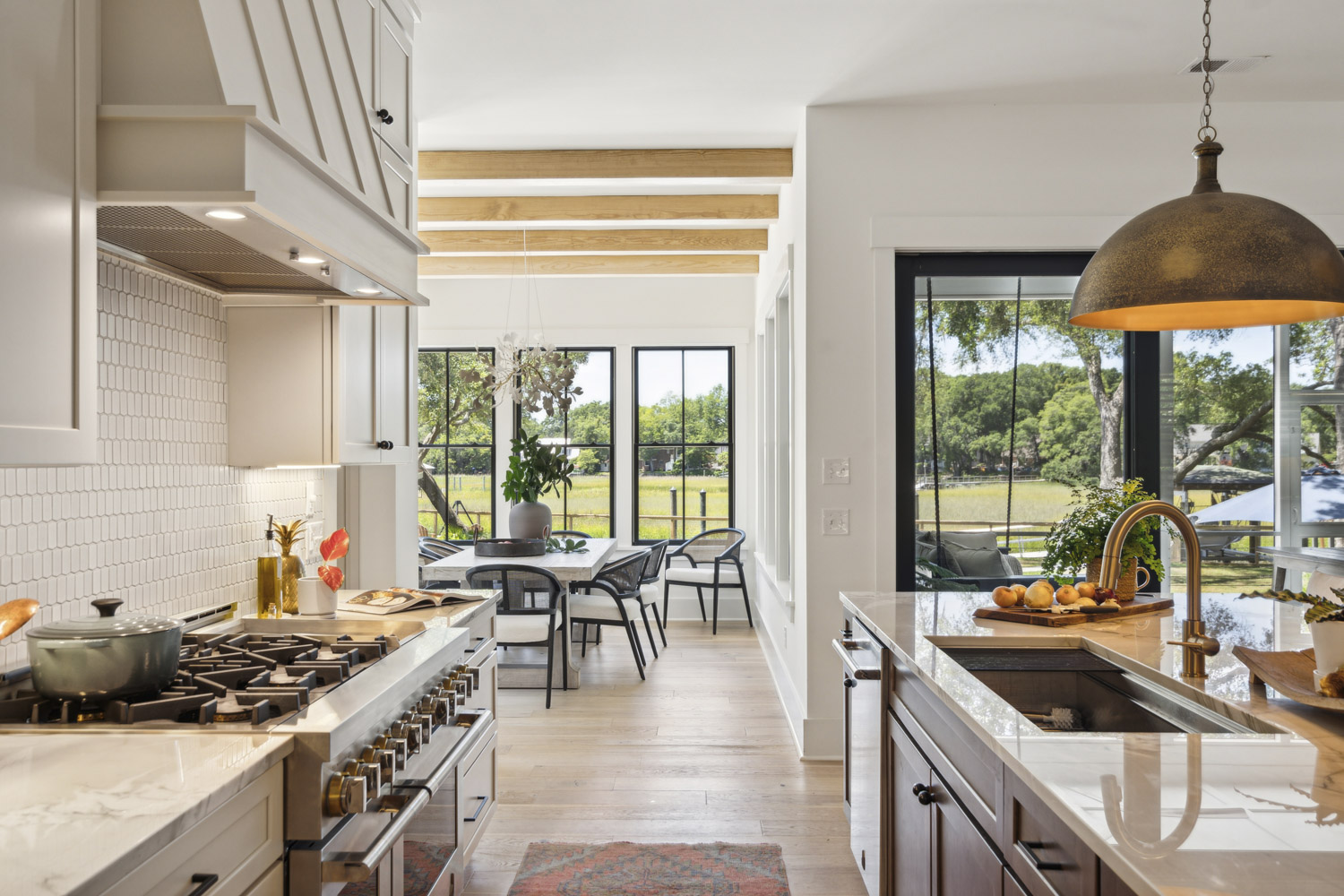 Kitchen countertops with home decor overlooking dining room and screened porch